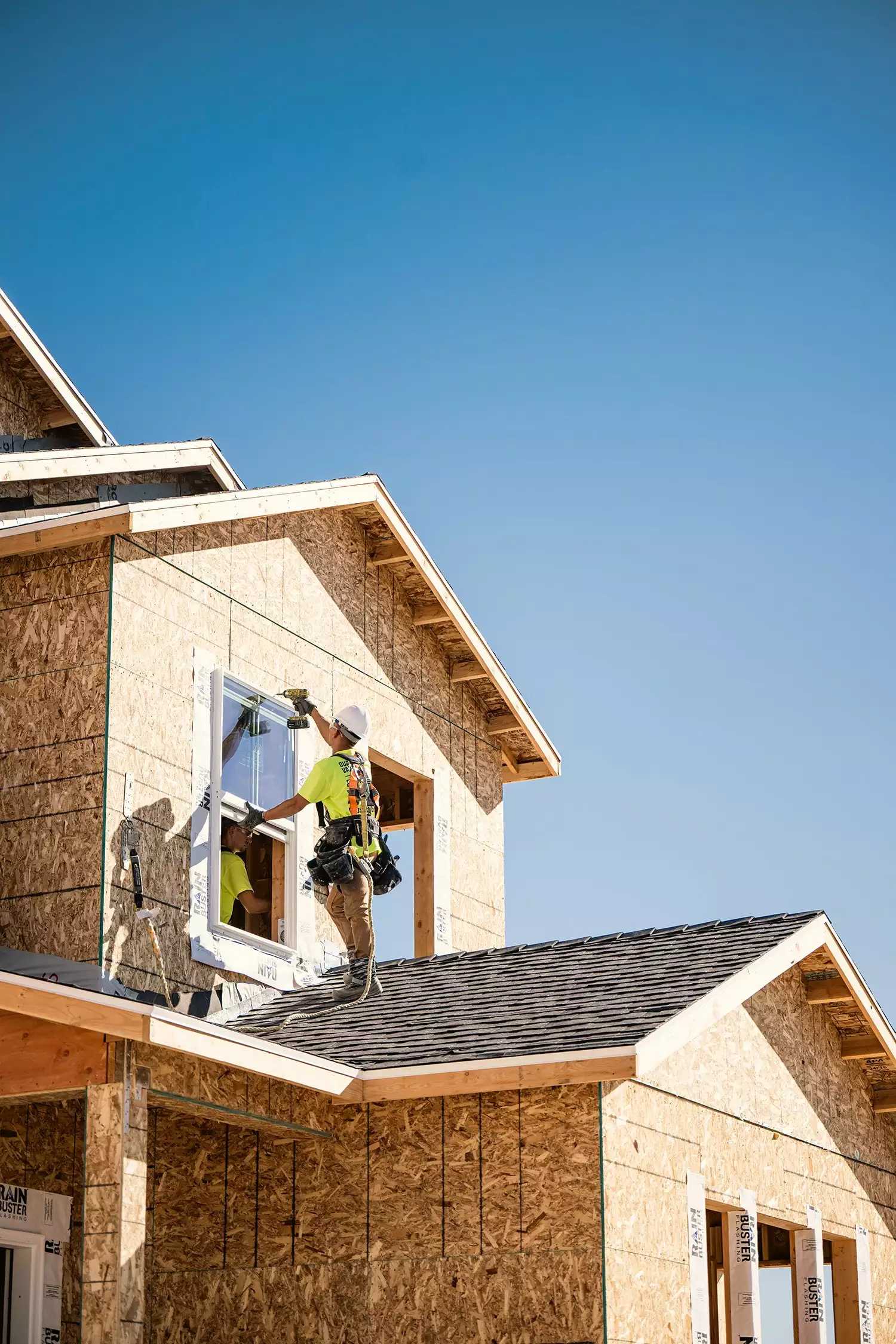 BFS Worker Installing Window on New Home